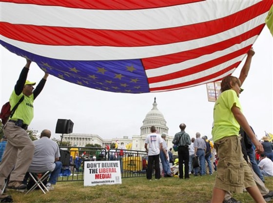 People gather at the Capitol for a "Remember in November" rally to express opposition to government spending, particularly bailouts and economic policies backed by President Obama and Democrats in Congress, in Washington on Sunday.